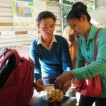 Clear Cambodia's Battambang staff test open well water with the CBT